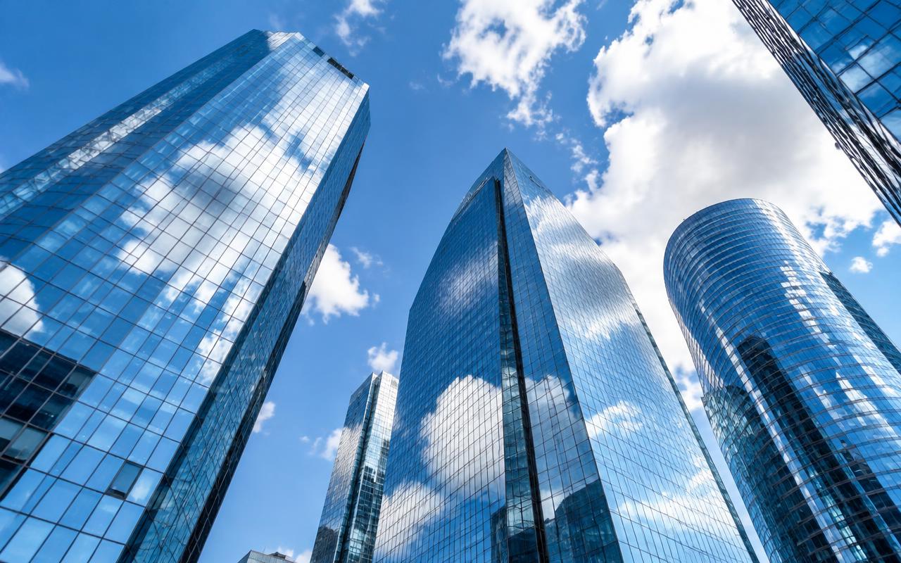 Glass bank towers against a blue sky